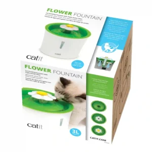 Cat drinking from flower-shaped water fountain box.