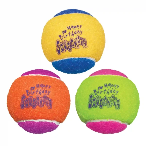 Three colorful squeaky birthday tennis balls.