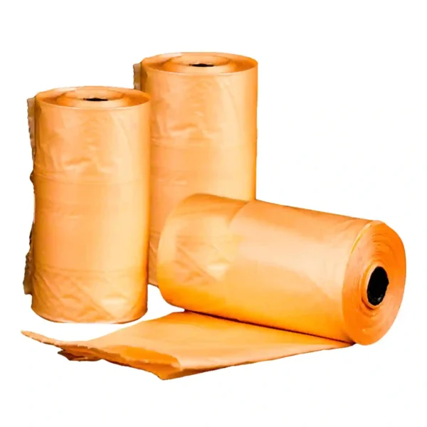 Three orange plastic bag rolls on display.